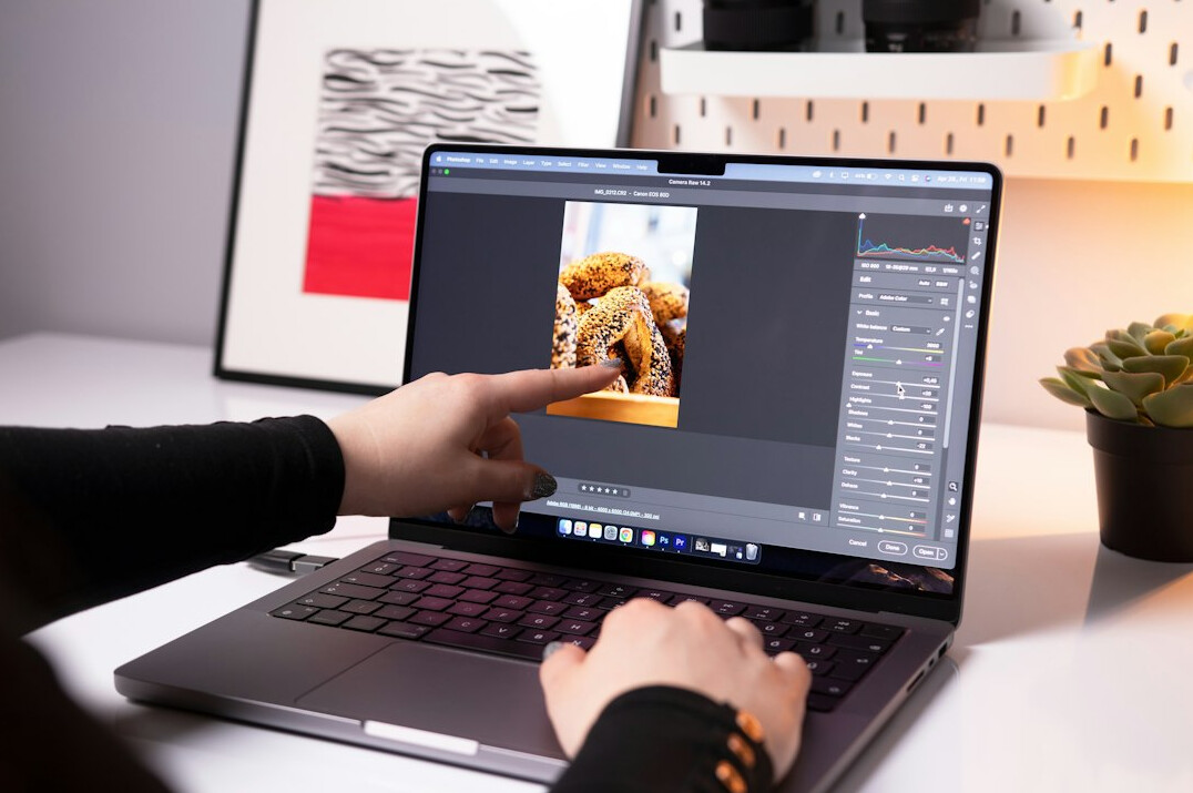 filmmaker reviewing footage on laptop